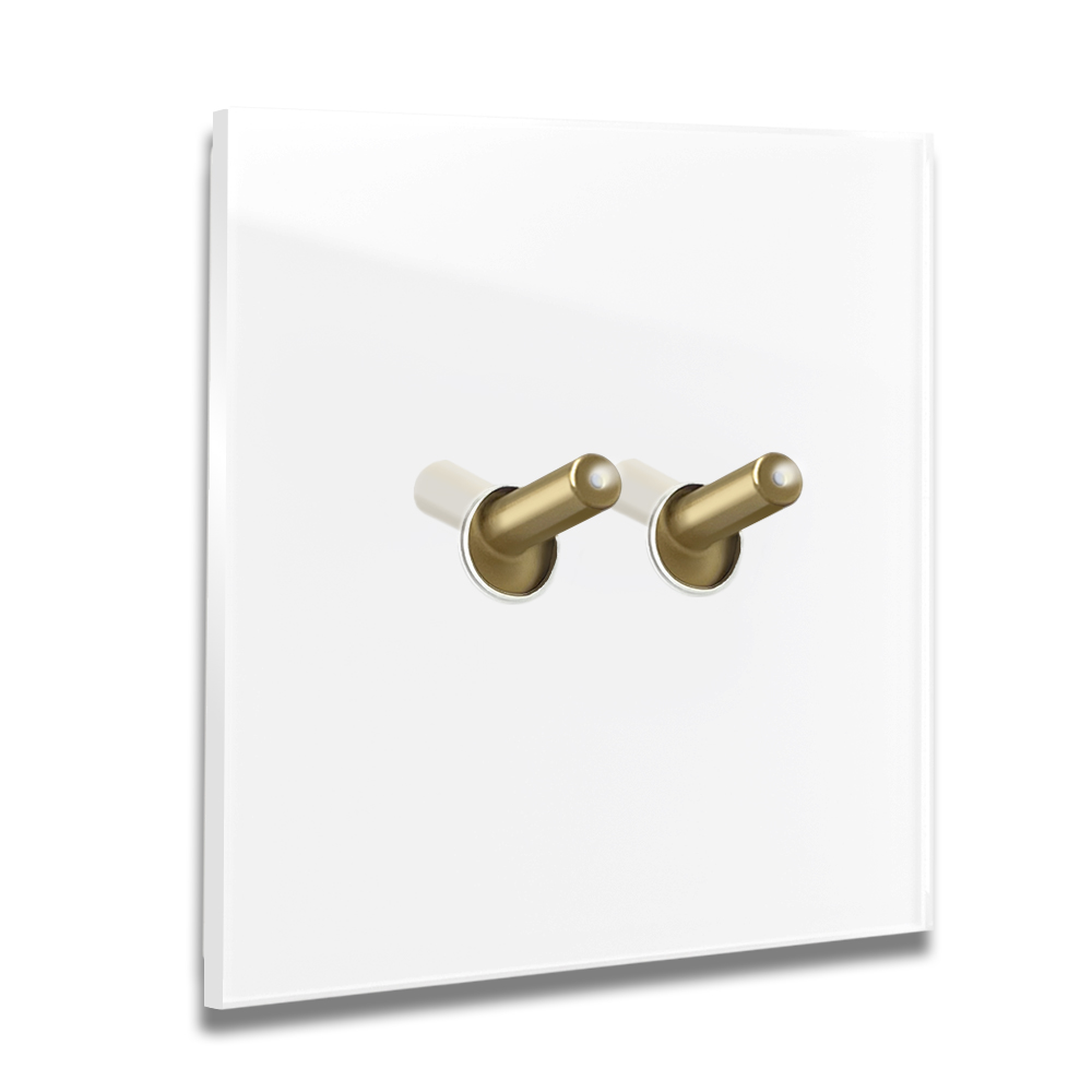 Modern illuminated design light switch in white glass optic with 2 brass toggle levers. YORK